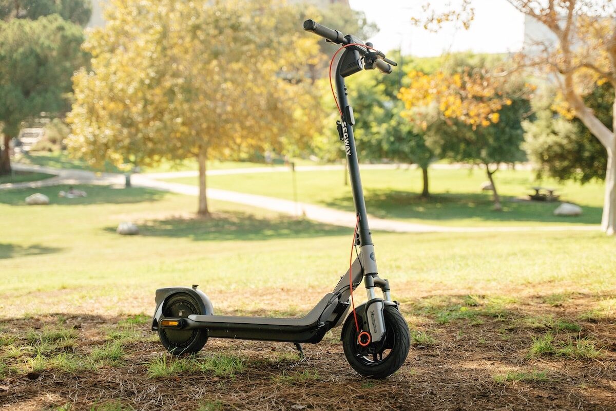 Segway E3 Go e-scooter parked on grass in a park